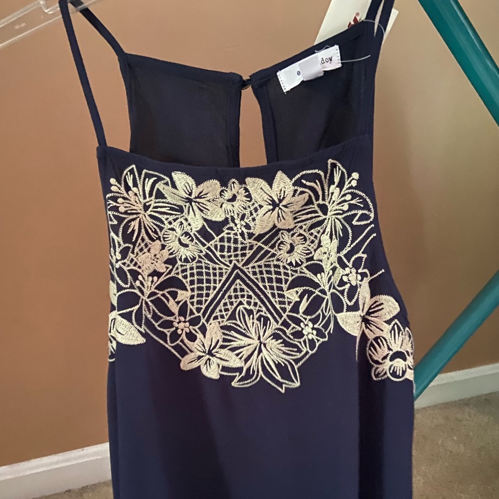 Brand new navy sleeveless blouse. Size large